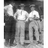 Frank Coffyn (left) and Walter Brookins (right) with Roy Knabenshue(center) outside boardwalk shed for Wright transitional aircraft.