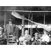 Group of men, including Frank Coffyn (right), behind a Wright aircraft in the boardwalk airplane shed at Atlantic City.