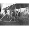 Frank Coffyn preparing for flight in Model B with an unidentified passenger.