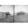 Two views of a hangar with a Model B inside.