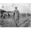 Frank Coffyn walking in front of a Wright Model B.
