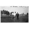 Frank Coffyn, Walter Brookins, and Griffith Brewer in a field.