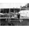 Kingsland Coffyn, an unidentified child, and Frank Coffyn posing in a Wright aircraft.