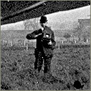 A photographer with a hand-held camera.