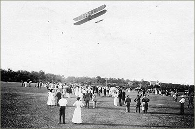 Wright Model B over an exhibition crowd.