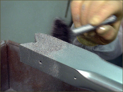 Applying the aluminum finish.