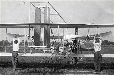 Students preparing to start a Wright transitional aircraft.