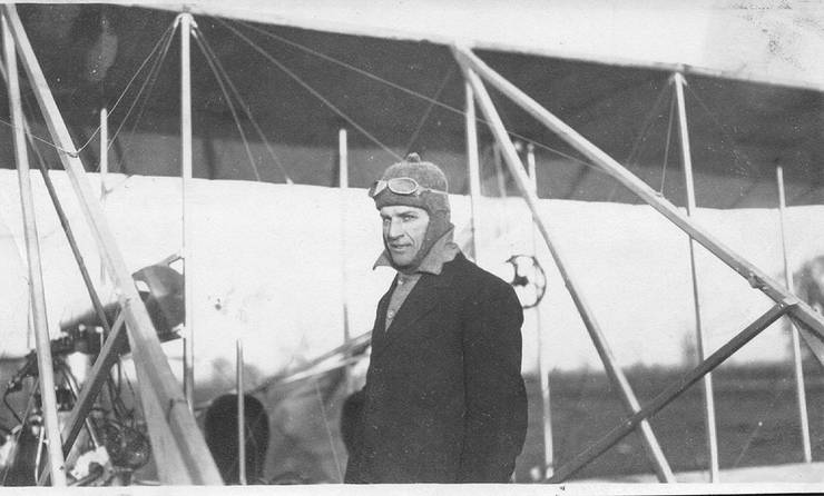 Frank Coffyn in front of an early Wright Model B aircraft after a flight.  Inscription handwritten on reverse: