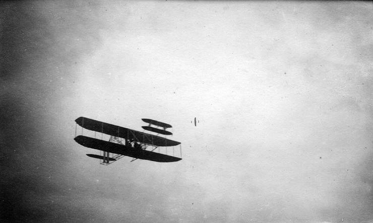 Two Wright transitional aircraft in flight.