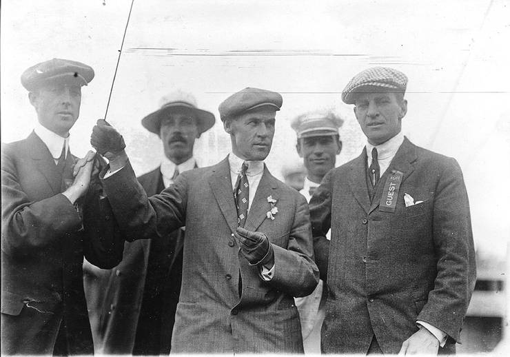 Frank Coffyn (right) with unidentified men at an exhibition.