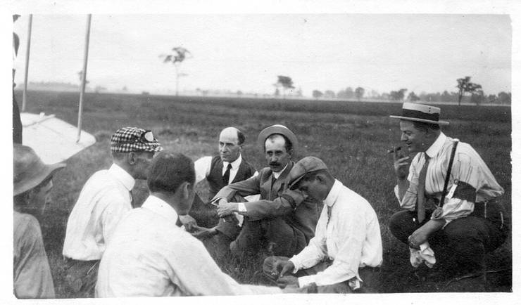 Wilbur and Orville Wright with pilots, at the Wright team's first meet.