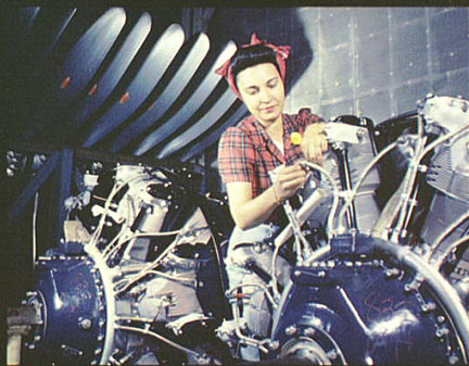 Woman working on an airplane motor