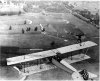 Wingwalker Ormer Locklear poses atop his plane's wings