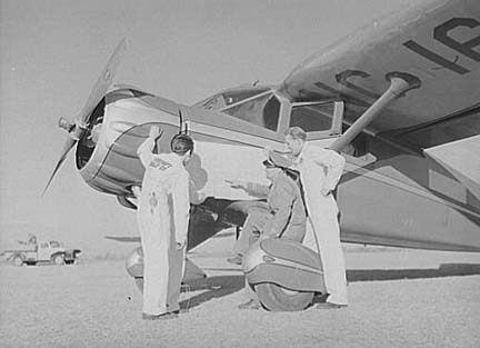 CPTP instructor and students studying map