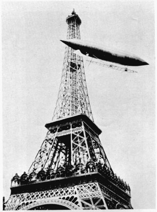 Dumont flies his airship around the Eiffel Tower