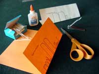 Toothpicks, glue, wing patterns, scissors, and fingernail clippers