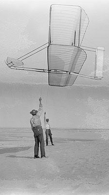 Dan Tate and Wilbur kiting the 1902 glider immediately after it was assembled. Image credit:Library of Congress